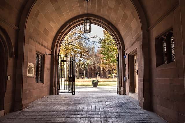 Phelps Gate at Yale University looking in towards the campus with people visible in the distance.