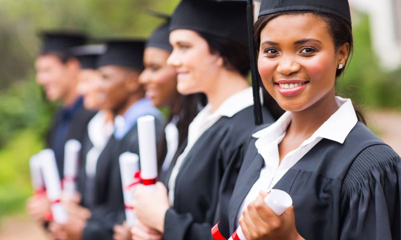 Happy students at high school graduation decide where to enroll for college