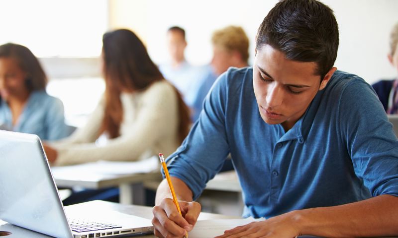 High School Students Taking Test In Classroom