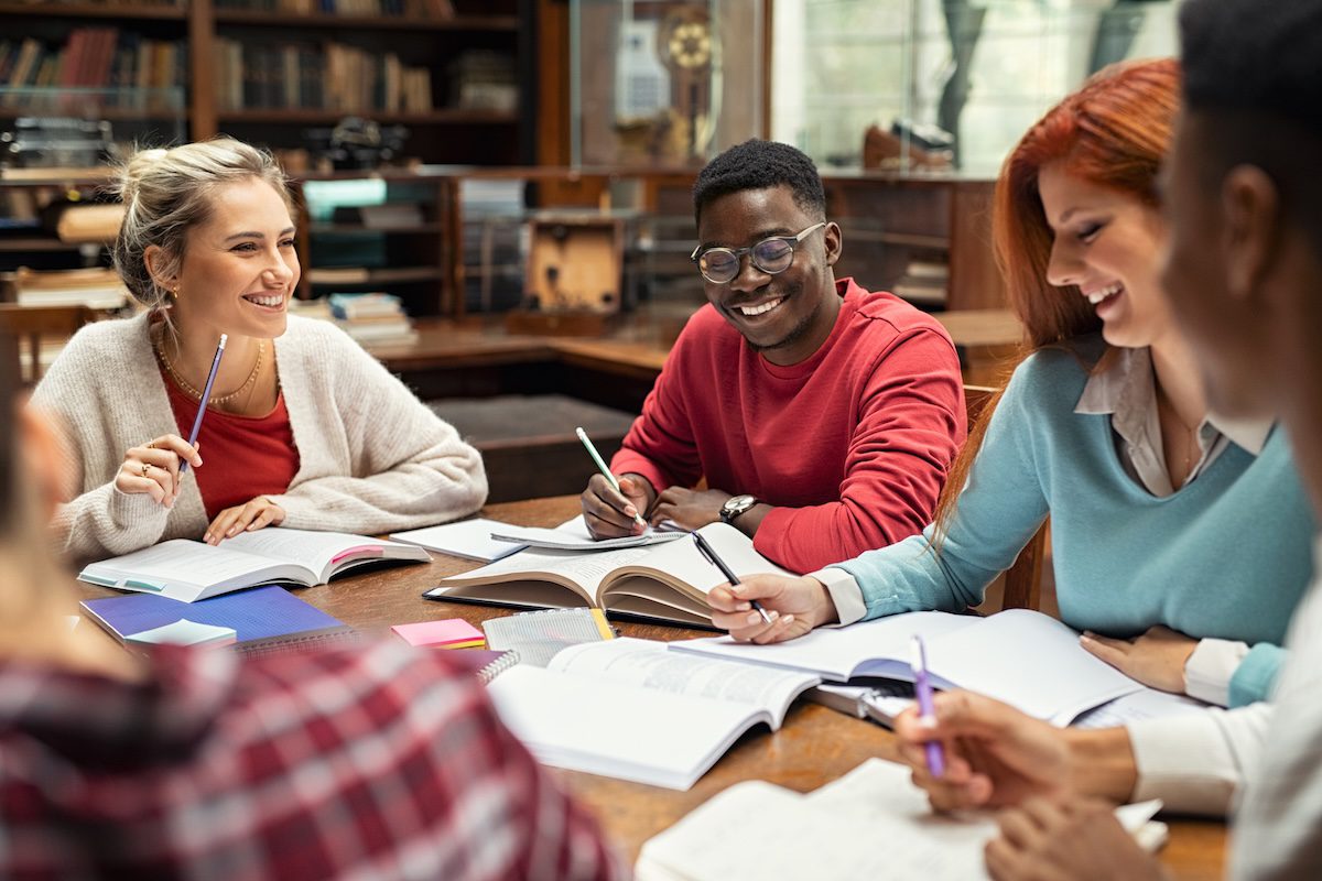 College students studying together in a library