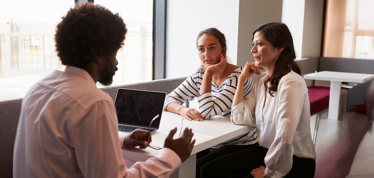 mother and daughter meeting with counselor