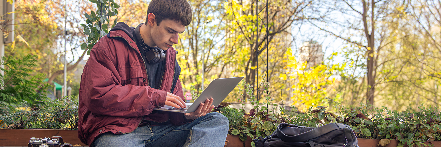 High school student doing homework and setting his academic goals for the fall semester.