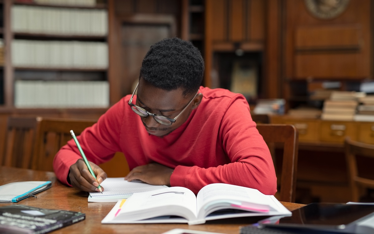 Student doing research in library