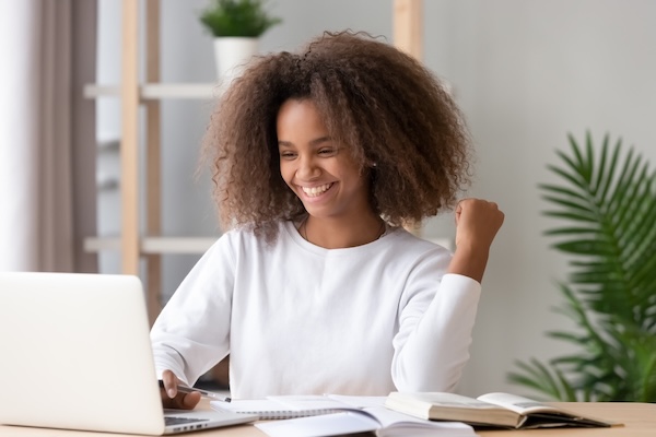 Excited african american teen school girl