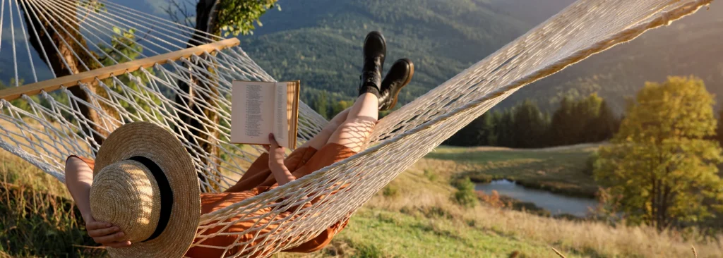 Student reading in hammock