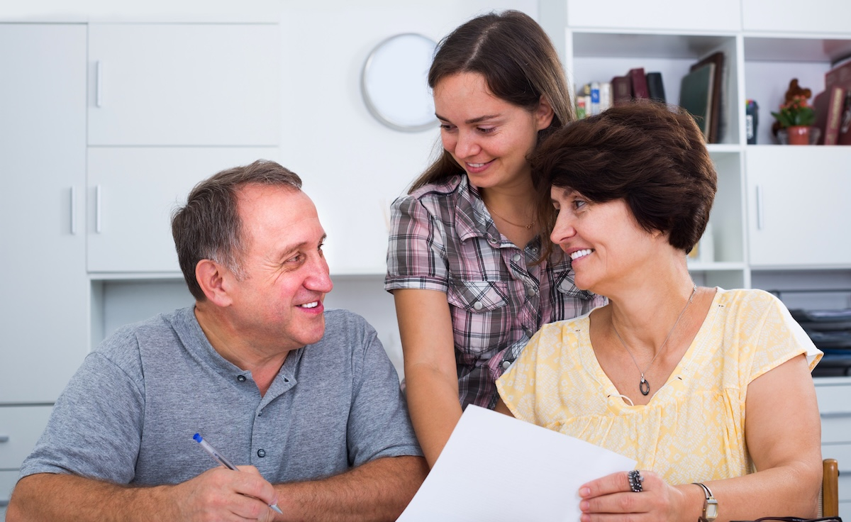 parents discussing college costs with their daughter
