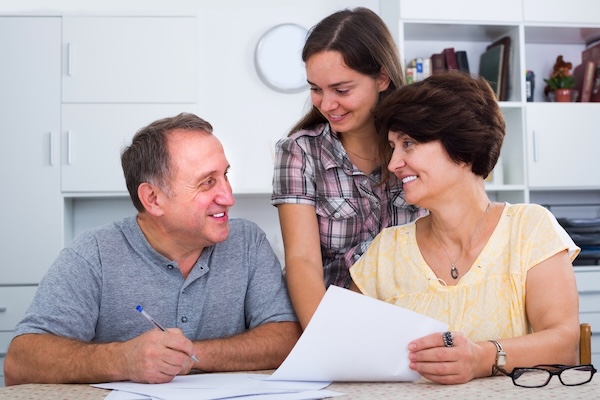 parents discussing college costs with their daughter