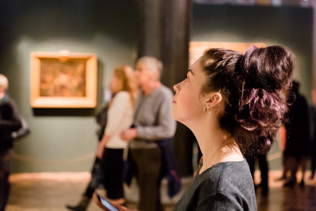 Young woman at an art museum during Maymester. Excursion with group.