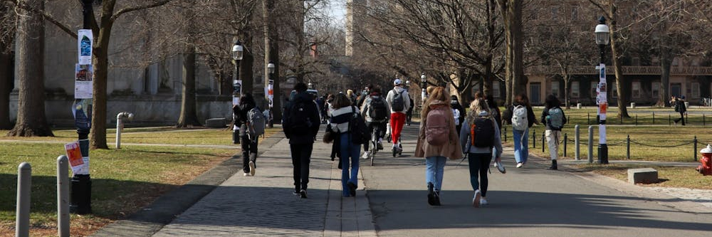 a group of students walking across campus