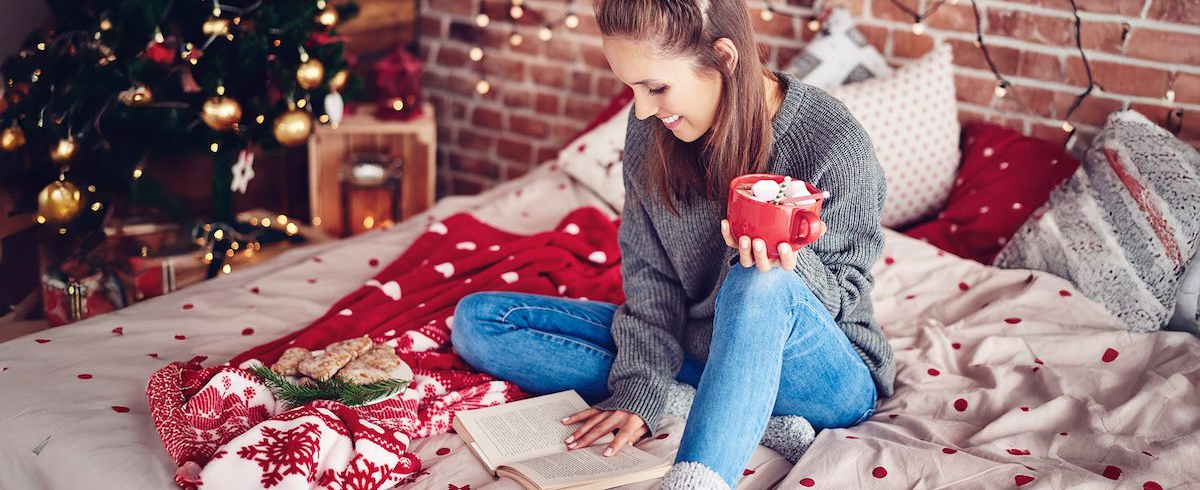 Student reading a book during winter break