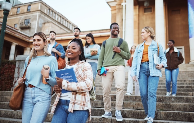 students walking on campus steps